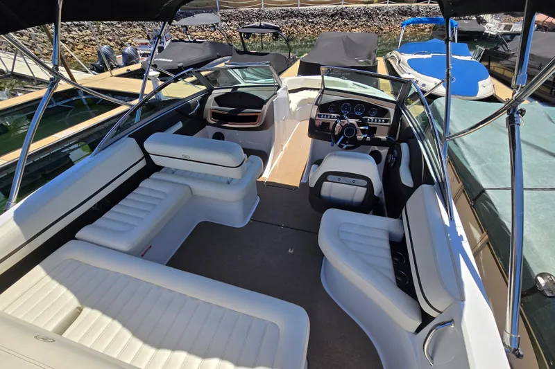 Slide: The Image of 2016 Cobalt R3 boat interior with white seating and modern dashboard. - 26