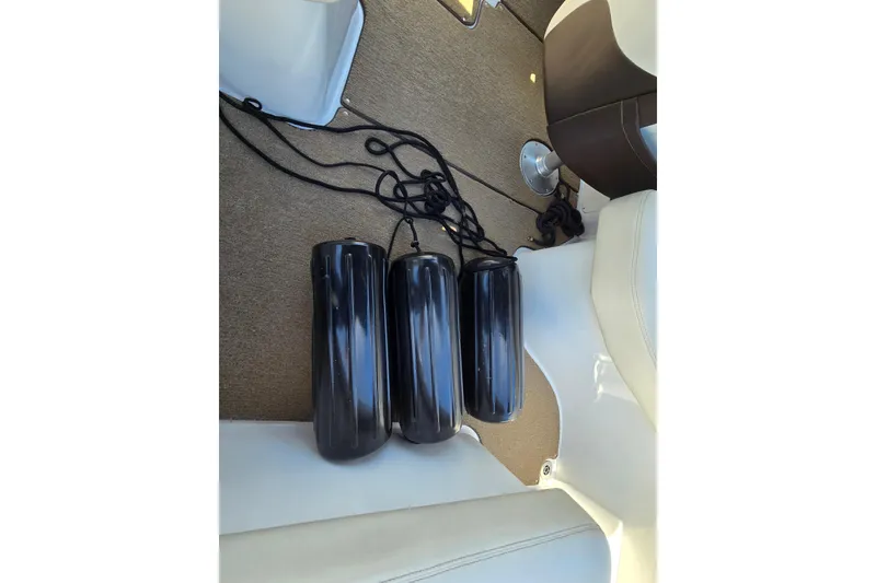 Slide: The Image of Black boat fenders on a 2016 Cobalt R3 interior floor. - 35