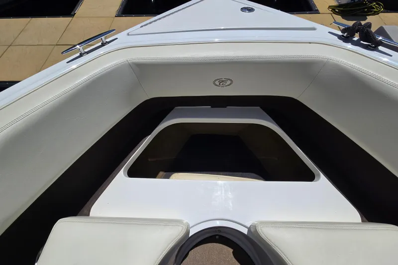 Slide: The Image of Bow seating area of a 2016 Cobalt R3 boat with white upholstery. - 38