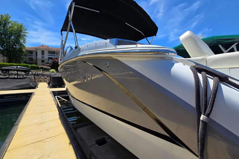 Slide: The Image of 2016 Cobalt R3 boat docked under a clear blue sky. - 39
