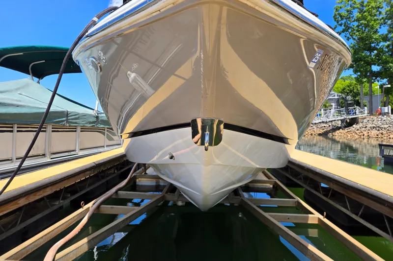 Slide: The Image of 2016 Cobalt R3 boat on a lift at a marina, sunny day. - 4