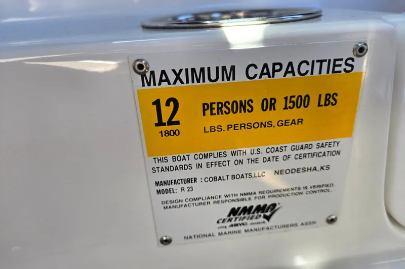Slide: The Image of Capacity label on 2016 Cobalt R3 boat, maximum 12 persons or 1500 lbs. - 43