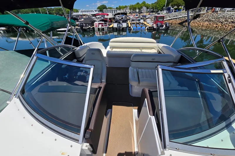 Slide: The Image of 2016 Cobalt R3 boat interior with seating, docked at a marina. - 6