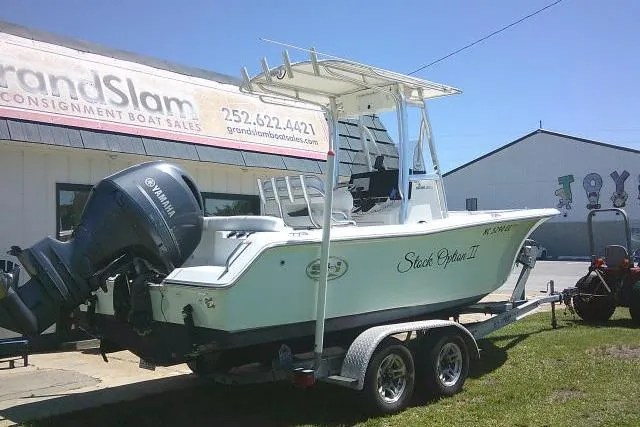 Slide: The Image of 2017 Sea Hunt Ultra 211 boat on trailer, parked outside Grand Slam Consignment Boat Sales. - 11