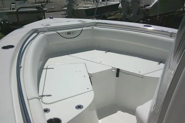 Slide: The Image of 2017 Sea Hunt Ultra 211 boat interior with spacious seating and storage compartments. - 16