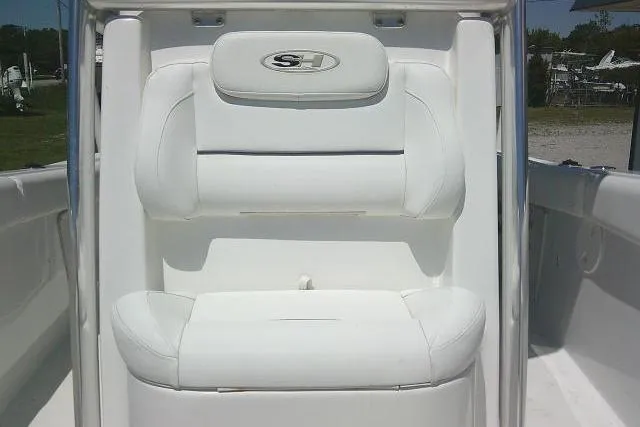 Slide: The Image of 2017 Sea Hunt Ultra 211 boat seat with white upholstery and logo. - 17