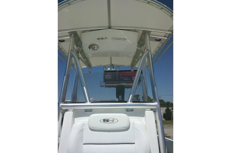 Slide: The Image of 2017 Sea Hunt Ultra 211 boat with T-top and sleek design. - 18