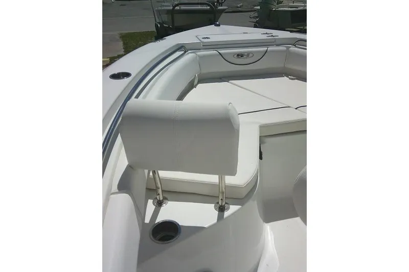 Slide: The Image of 2017 Sea Hunt Ultra 211 boat interior with white seating and cup holders. - 27