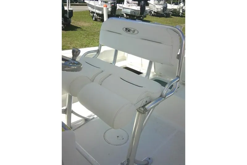 Slide: The Image of 2017 Sea Hunt Ultra 211 boat seat with white upholstery and metal frame. - 29