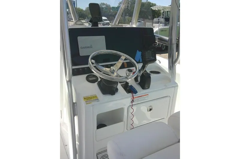 Slide: The Image of 2017 Sea Hunt Ultra 211 boat console with Garmin navigation system and steering wheel. - 31