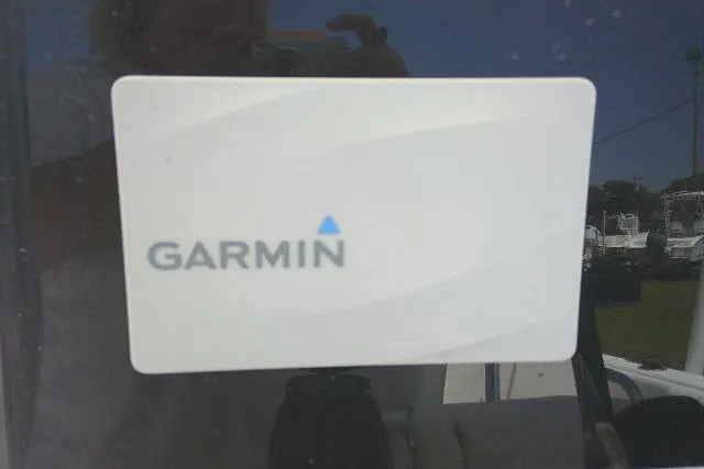 Slide: The Image of Garmin logo on 2017 Sea Hunt Ultra 211 boat dashboard. - 32