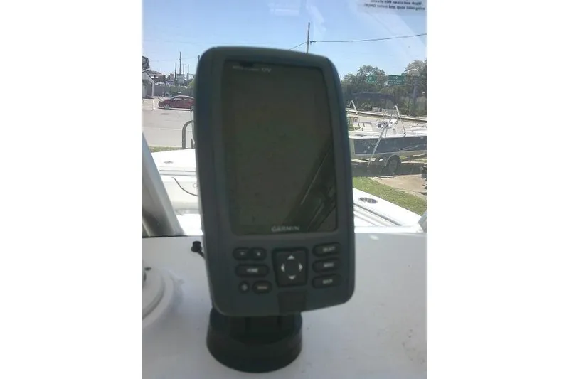 Slide: The Image of Garmin GPS device on 2017 Sea Hunt Ultra 211 boat dashboard, outdoor setting. - 33
