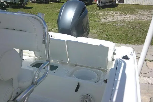 Slide: The Image of 2017 Sea Hunt Ultra 211 boat interior with seating and outboard motor. - 36