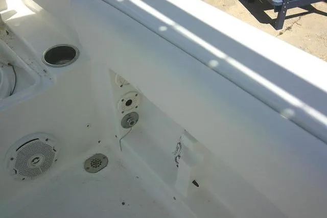 Slide: The Image of Interior view of a 2017 Sea Hunt Ultra 211 boat, featuring white deck and speaker. - 38