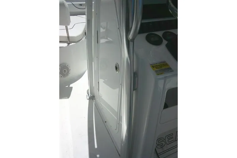 Slide: The Image of 2017 Sea Hunt Ultra 211 boat interior with console and seating area. - 39