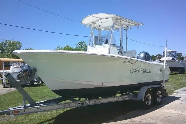 Slide: The Image of 2017 Sea Hunt Ultra 211 boat on trailer, parked outdoors on a sunny day. - 4