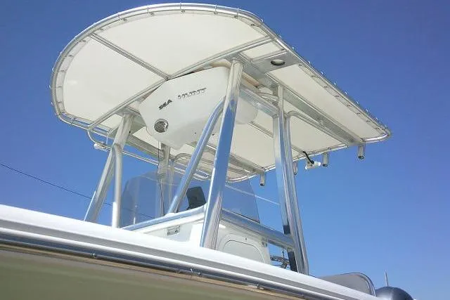 Slide: The Image of 2017 Sea Hunt Ultra 211 boat with T-top against clear blue sky. - 6