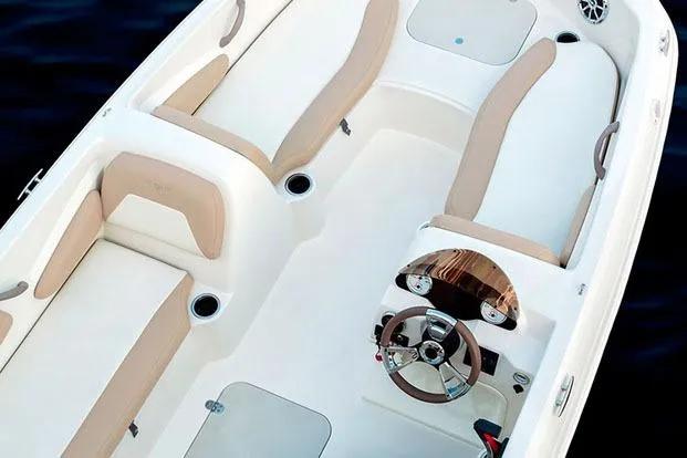 Slide: The Image of Manufacturer Provided Image: 2019 Stingray 182 SC boat interior with beige and white seating. - 13