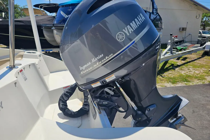 Slide: The Image of 2019 Stingray 182 SC boat with Yamaha four-stroke outboard motor in a sunny outdoor setting. - 17