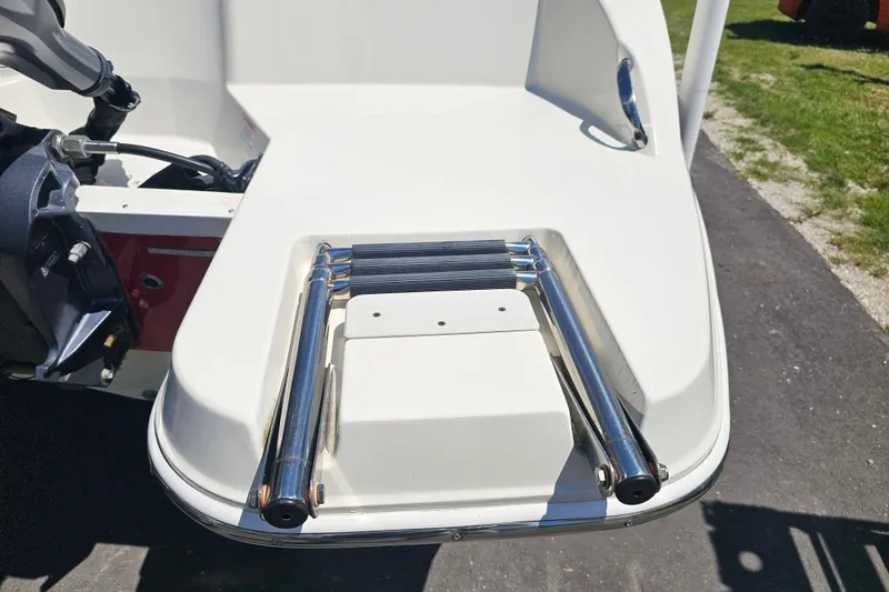 Slide: The Image of 2019 Stingray 182 SC boat with stainless steel swim ladder on deck. - 18