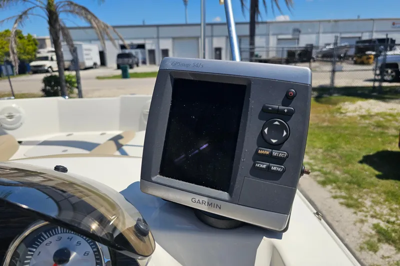 Slide: The Image of Garmin GPS device on 2019 Stingray 182 SC boat dashboard, sunny outdoor setting. - 26