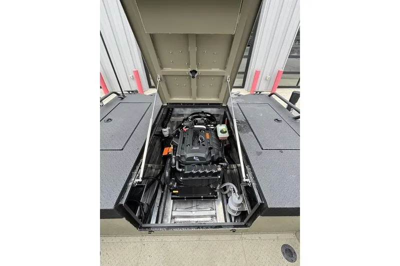 Slide: The Image of Open engine compartment of 2026 SeaArk Predator 300 AK boat, showcasing internal components. - 12