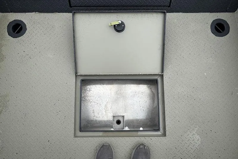 Slide: The Image of Open storage compartment on 2026 SeaArk Predator 300 AK boat deck. - 15