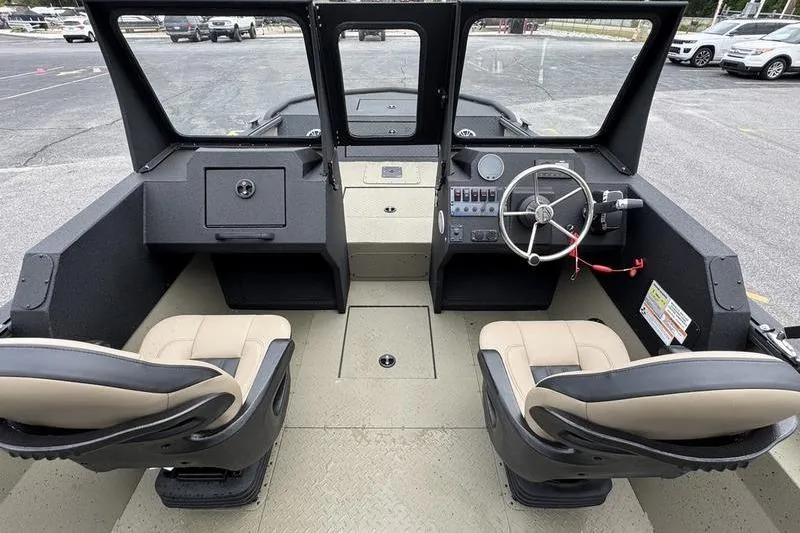 Slide: The Image of Interior view of 2026 SeaArk Predator 300 AK boat with dual seats and steering console. - 18