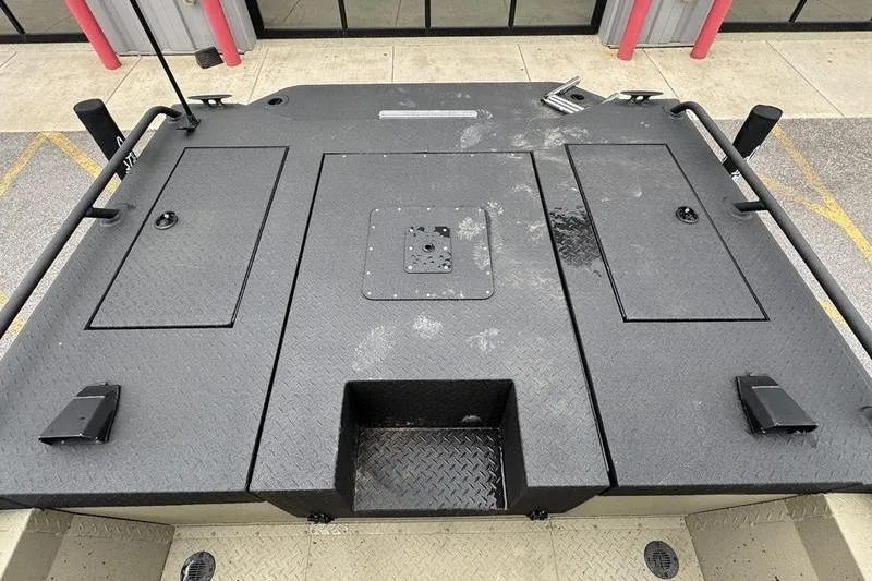 Slide: The Image of 2026 SeaArk Predator 300 AK boat deck with storage compartments and non-slip surface. - 21