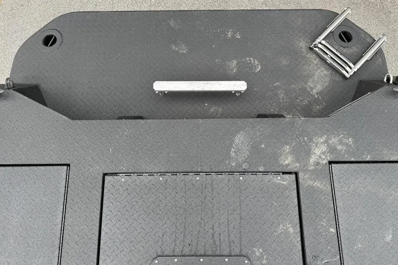 Slide: The Image of 2026 SeaArk Predator 300 AK boat deck with textured surface and metal fittings. - 6