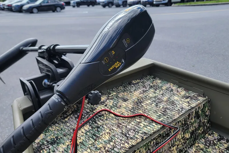 Slide: The Image of Trolling motor on 2025 Tracker Grizzly 12 Jon boat with camouflage interior. - 4