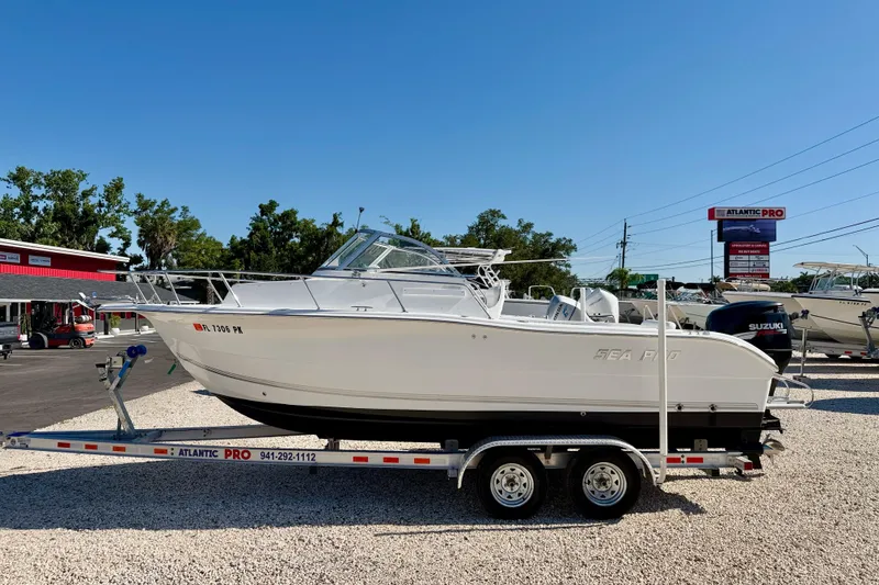 The Image of 2005 Sea Pro 220 Walk Around boat on trailer at dealership. - 0