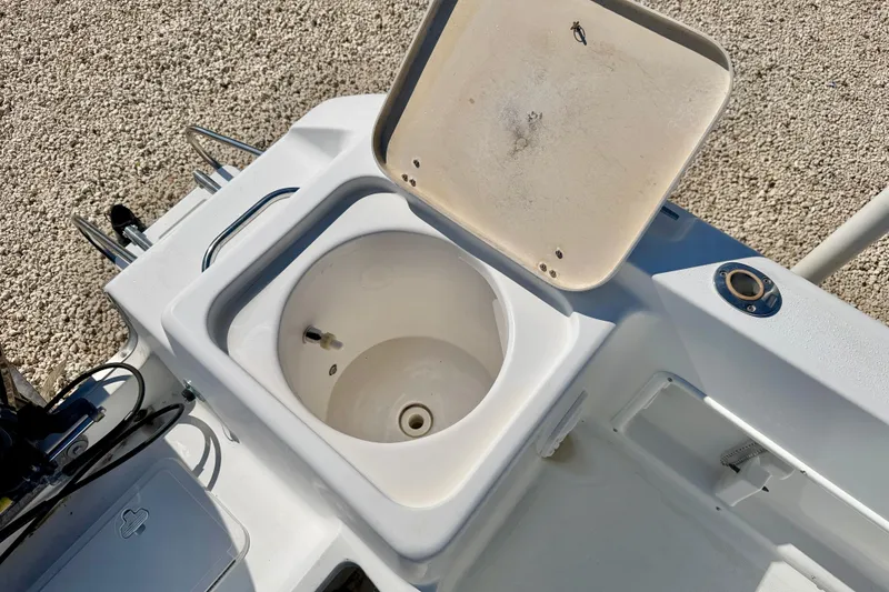 Slide: The Image of Open storage compartment on a 2005 Sea Pro 220 Walk Around boat. - 15