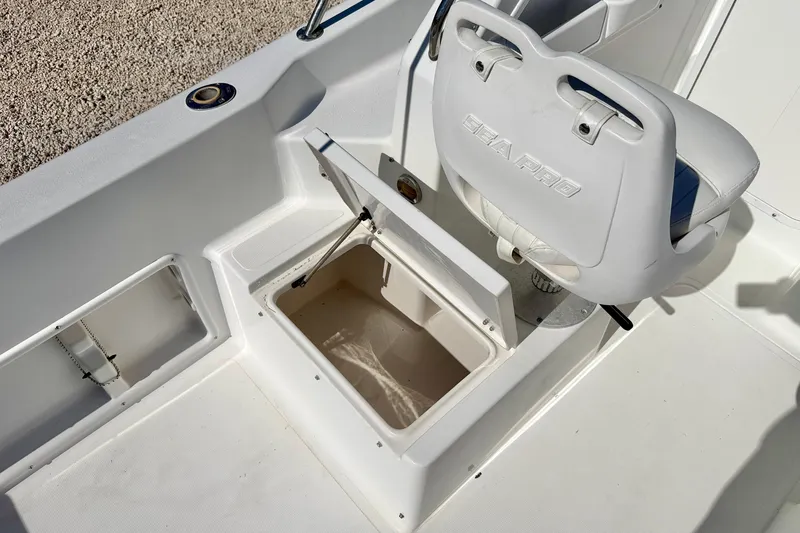 Slide: The Image of 2005 Sea Pro 220 Walk Around boat interior with storage compartment and seat. - 16