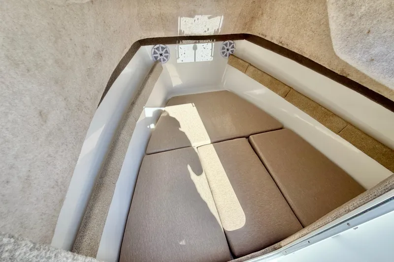 Slide: The Image of Interior cabin of 2005 Sea Pro 220 Walk Around boat with cushioned seating. - 28