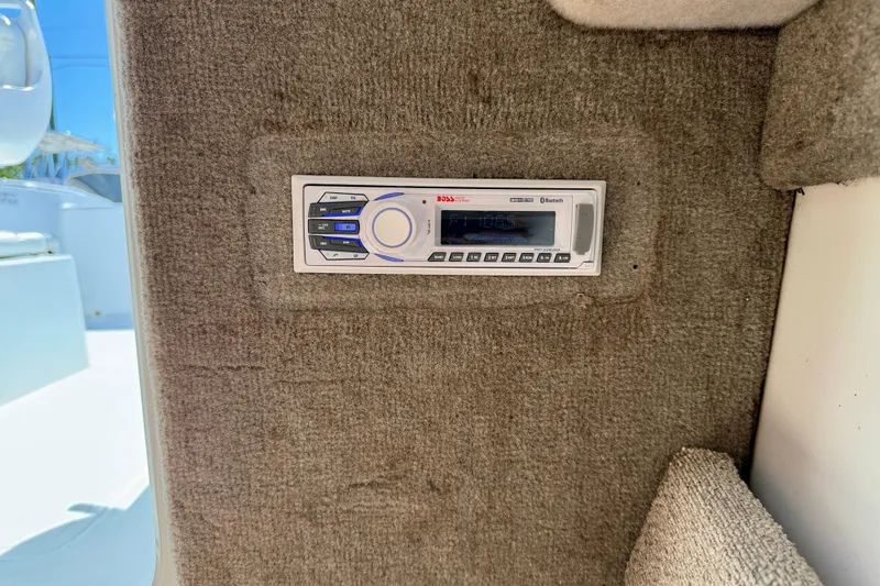 Slide: The Image of Boat stereo system on 2005 Sea Pro 220 Walk Around, mounted on carpeted surface. - 31