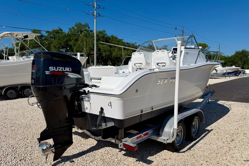 Slide: The Image of 2005 Sea Pro 220 Walk Around boat with Suzuki outboard motor on trailer. - 5