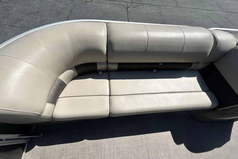 Slide: The Image of 2021 Sun Tracker Party Barge 20 DLX, beige seating, outdoor setting. - 12