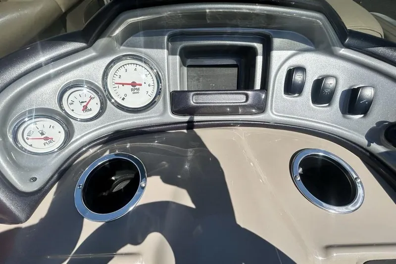 Slide: The Image of Dashboard of a 2021 Sun Tracker Party Barge 20 DLX with gauges and controls. - 21
