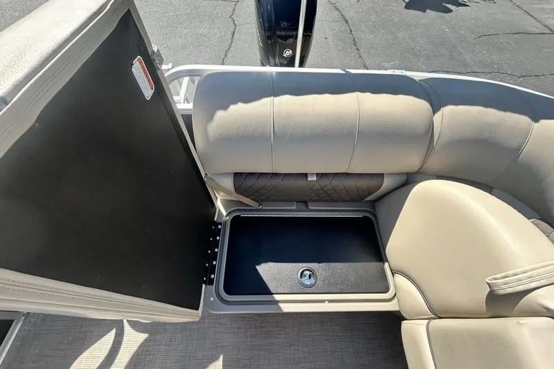 Slide: The Image of 2021 Sun Tracker Party Barge 20 DLX seating with storage compartment open. - 22