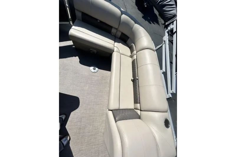 Slide: The Image of 2021 Sun Tracker Party Barge 20 DLX interior seating with beige upholstery. - 5