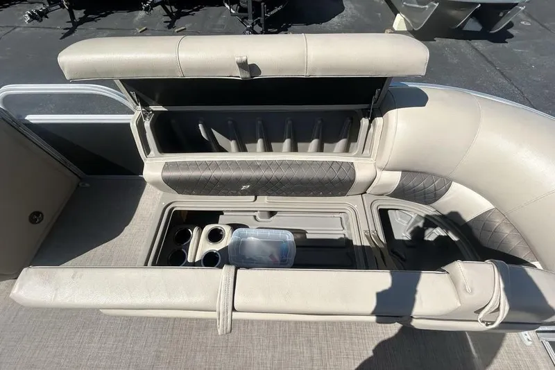 Slide: The Image of 2021 Sun Tracker Party Barge 20 DLX seating with storage and cup holders. - 6
