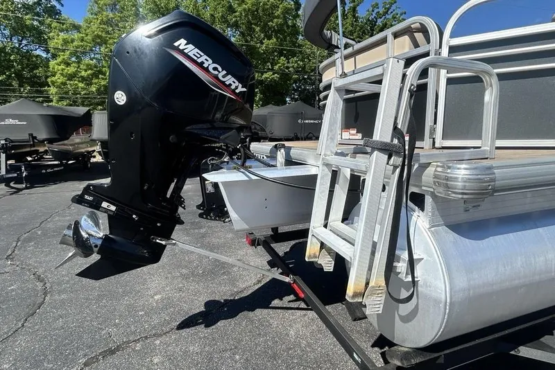 Slide: The Image of 2021 Sun Tracker Party Barge 20 DLX with Mercury outboard motor and ladder. - 7