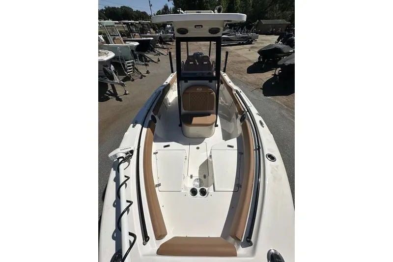 Slide: The Image of 2026 Key West 239 FSR boat with tan seating and sleek design. - 12