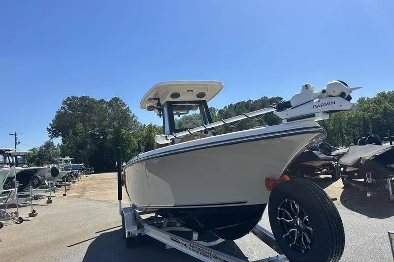 Slide: The Image of 2026 Key West 239 FSR boat on trailer under clear blue sky. - 19