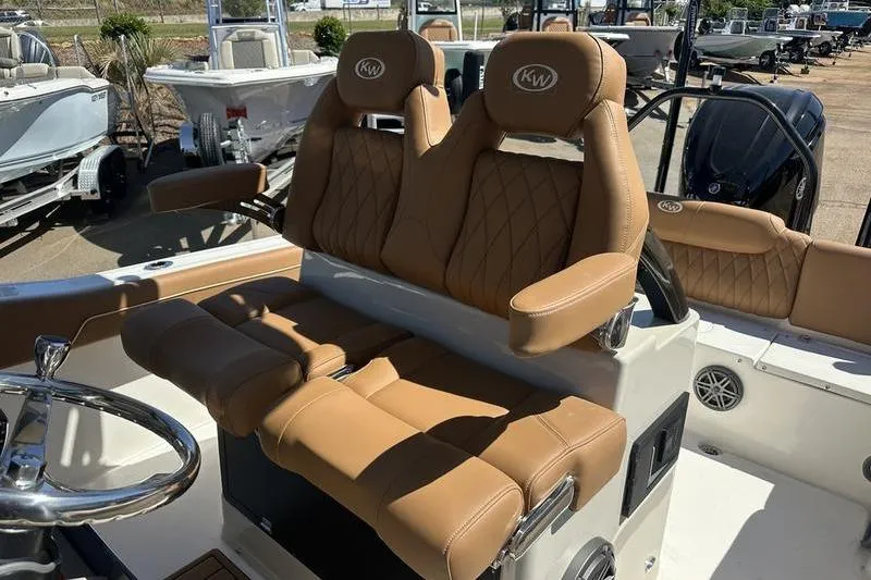 Slide: The Image of Luxurious seating on 2026 Key West 239 FSR boat, featuring tan leather upholstery. - 3
