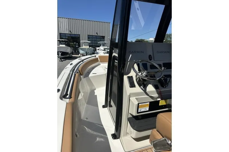 Slide: The Image of 2026 Key West 239 FSR boat interior with Garmin navigation system and sleek design. - 6