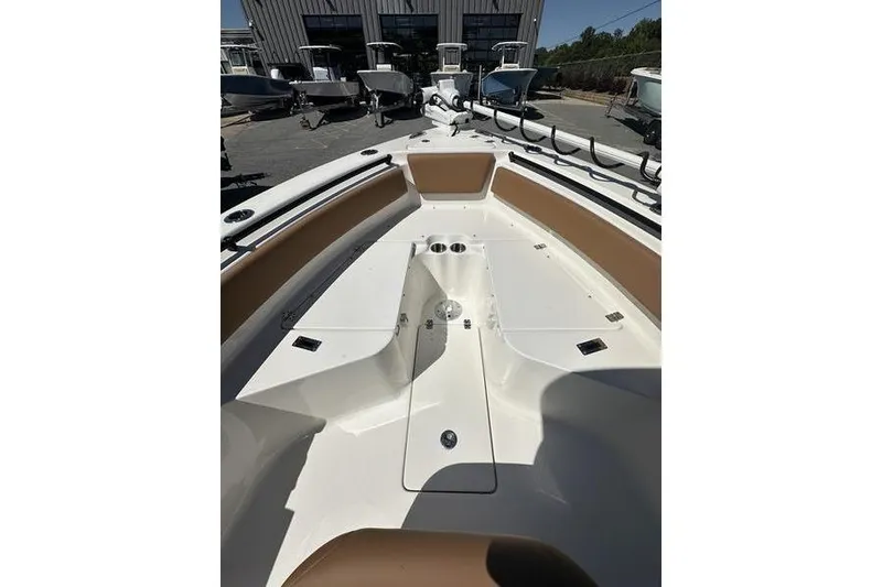 Slide: The Image of 2026 Key West 239 FSR boat interior with seating and storage compartments. - 7