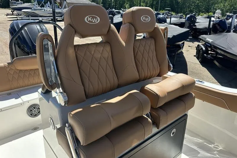 Slide: The Image of Luxury seating on 2026 Key West 239 FSR boat, featuring tan leather upholstery. - 9