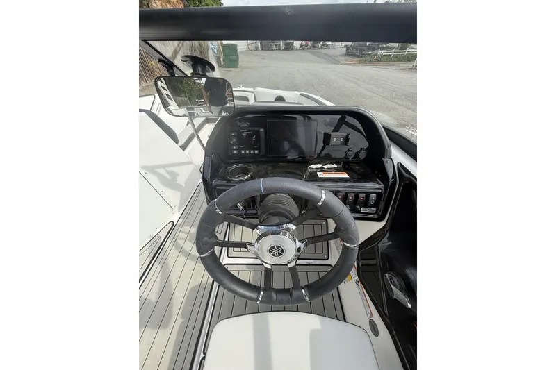 Slide: The Image of 2025 Yamaha Boats 195S dashboard with steering wheel and control panel. - 12
